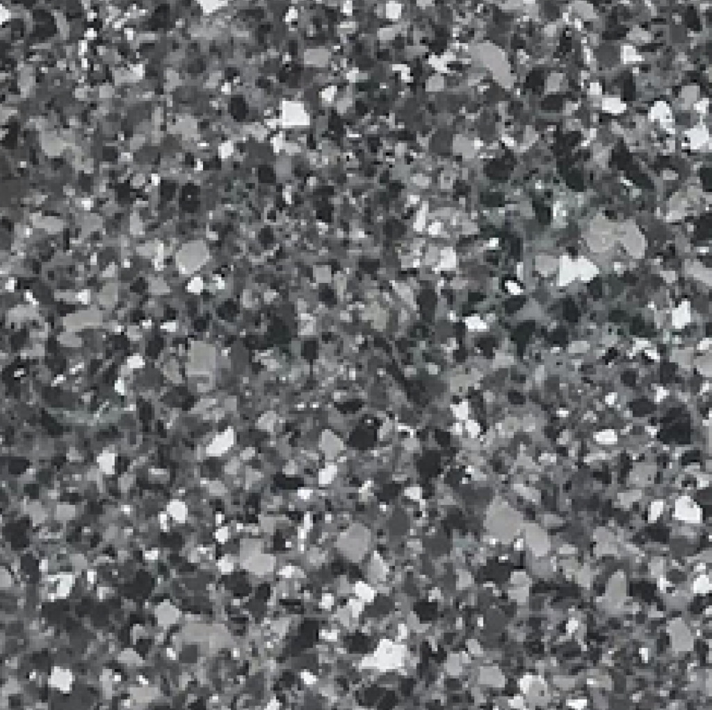 A close-up image of a terrazzo floor displaying a mix of grey, black, and white stone chips embedded in a concrete surface.